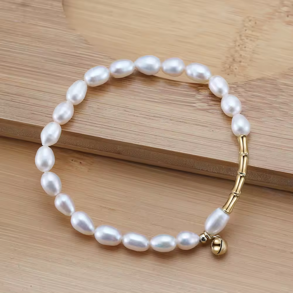 Perlenarmband mit Kügelchen Anhänger