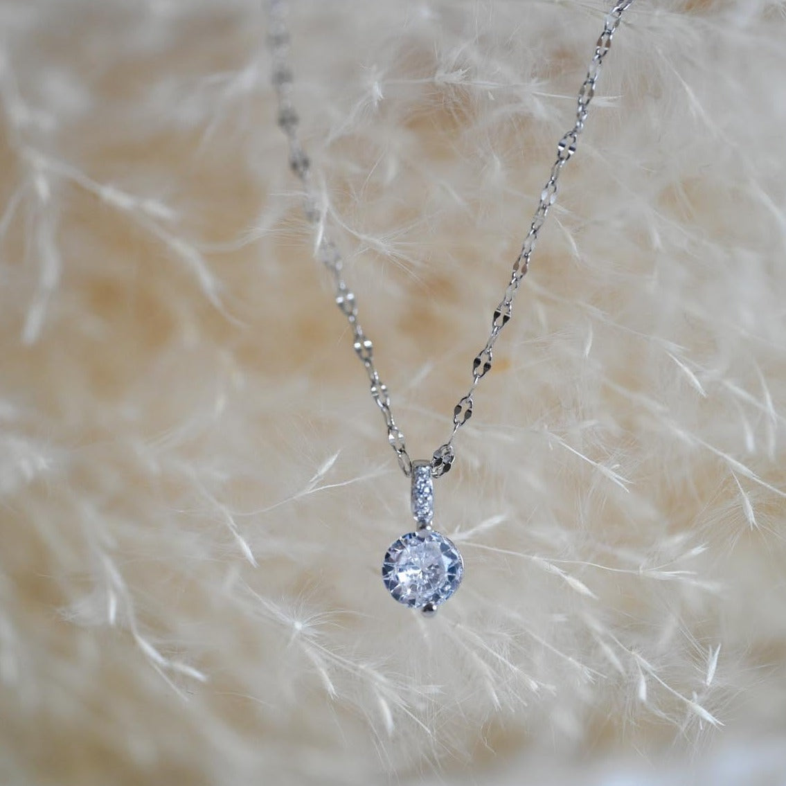 Elegant delicate necklace with zircon pendant