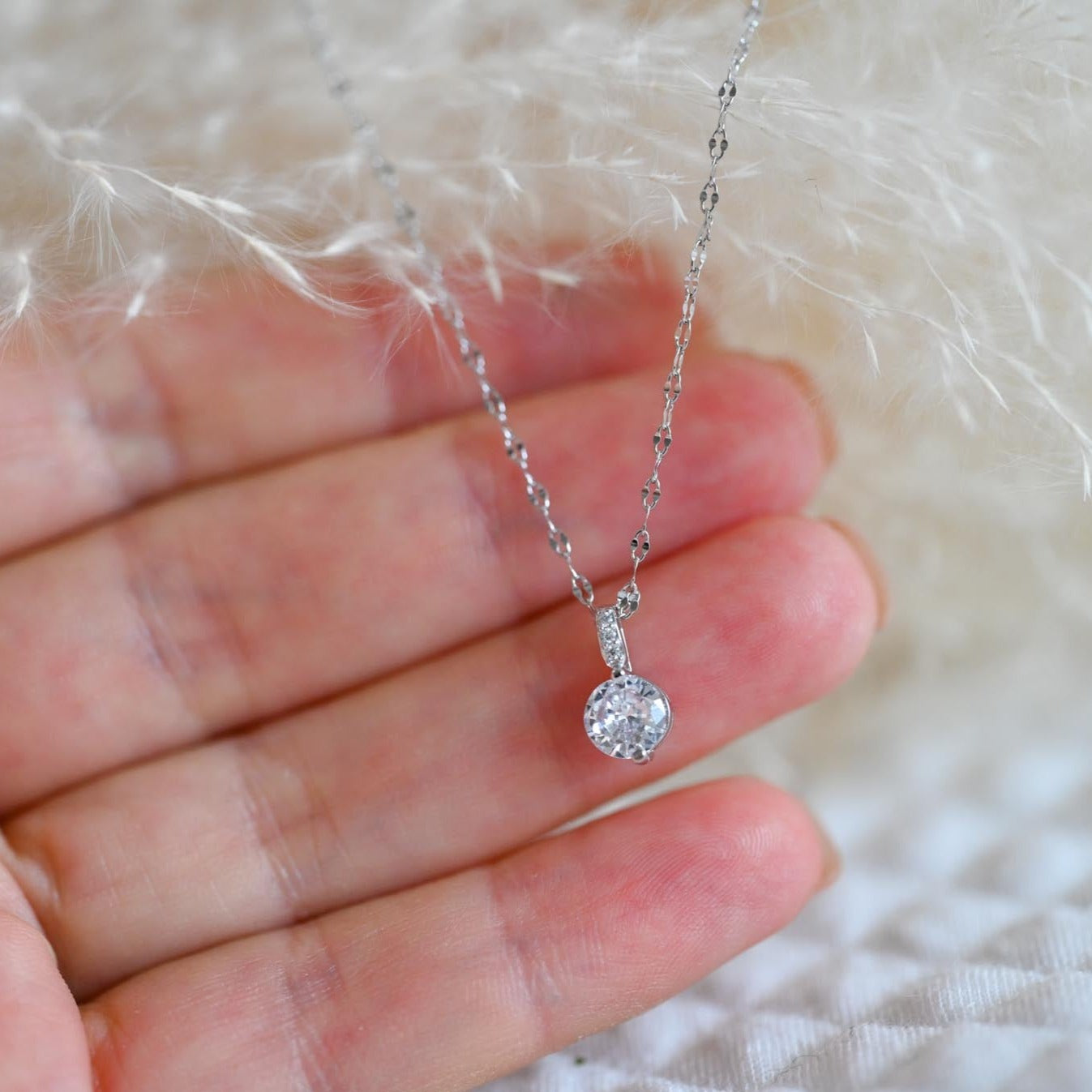Elegant delicate necklace with zircon pendant