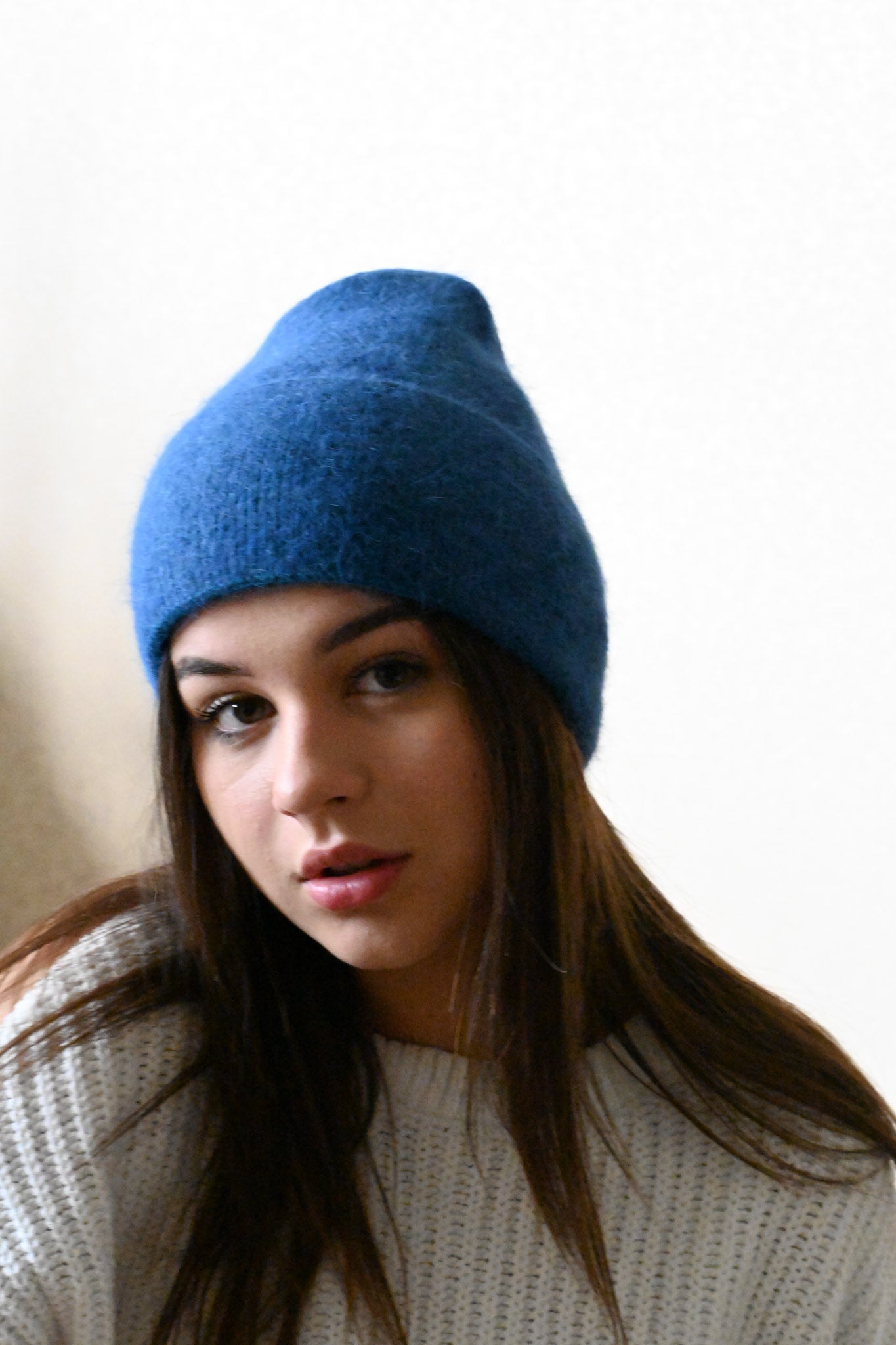 Warm, soft and fluffy hat made of merino wool and angora wool, blue