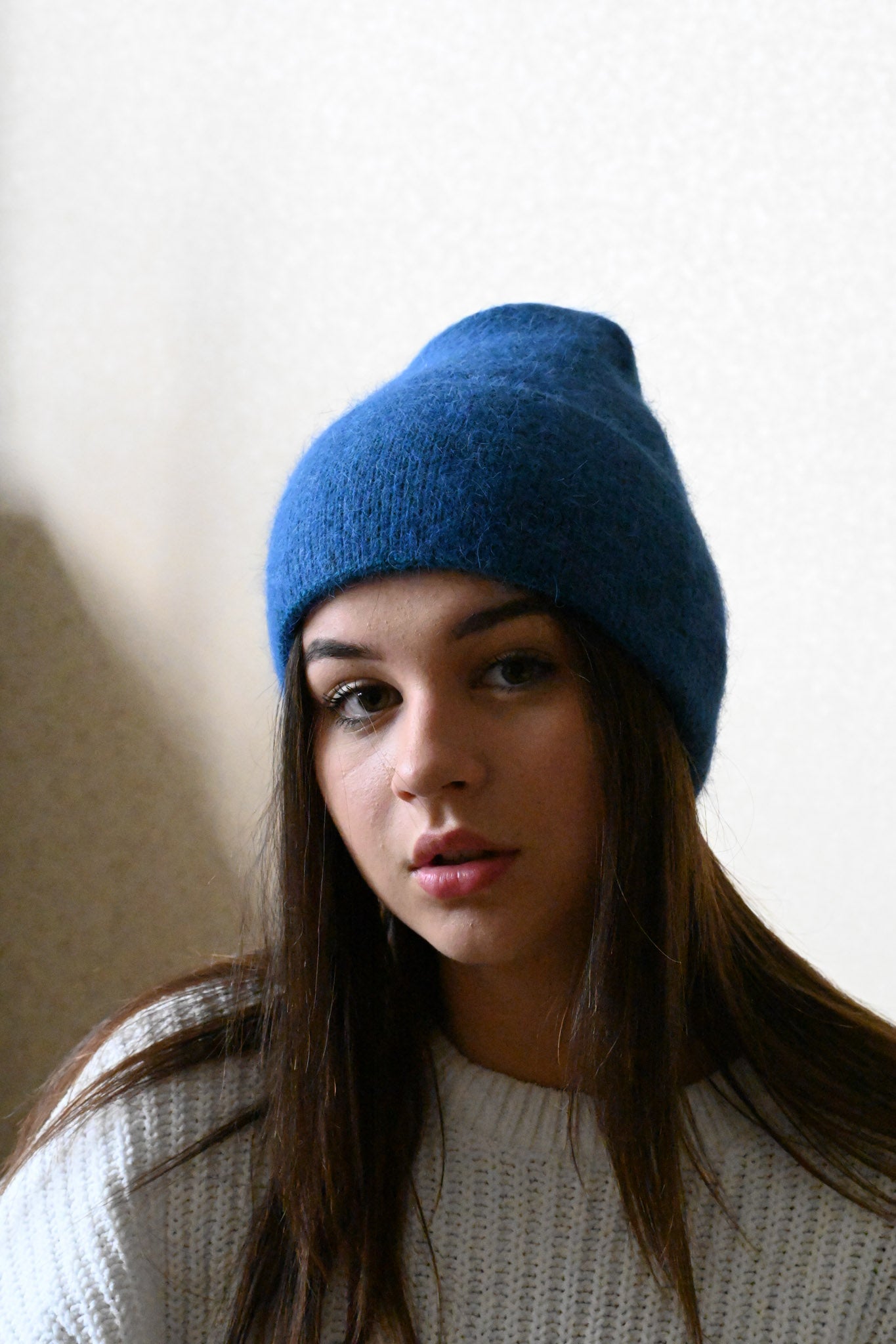 Warm, soft and fluffy hat made of merino wool and angora wool, blue