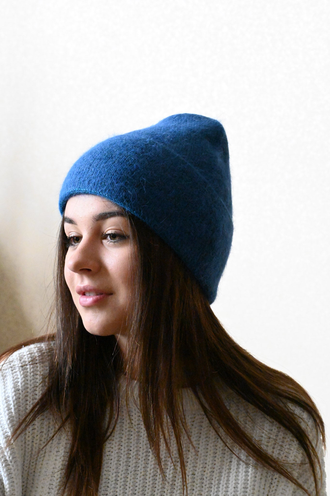 Warm, soft and fluffy hat made of merino wool and angora wool, blue