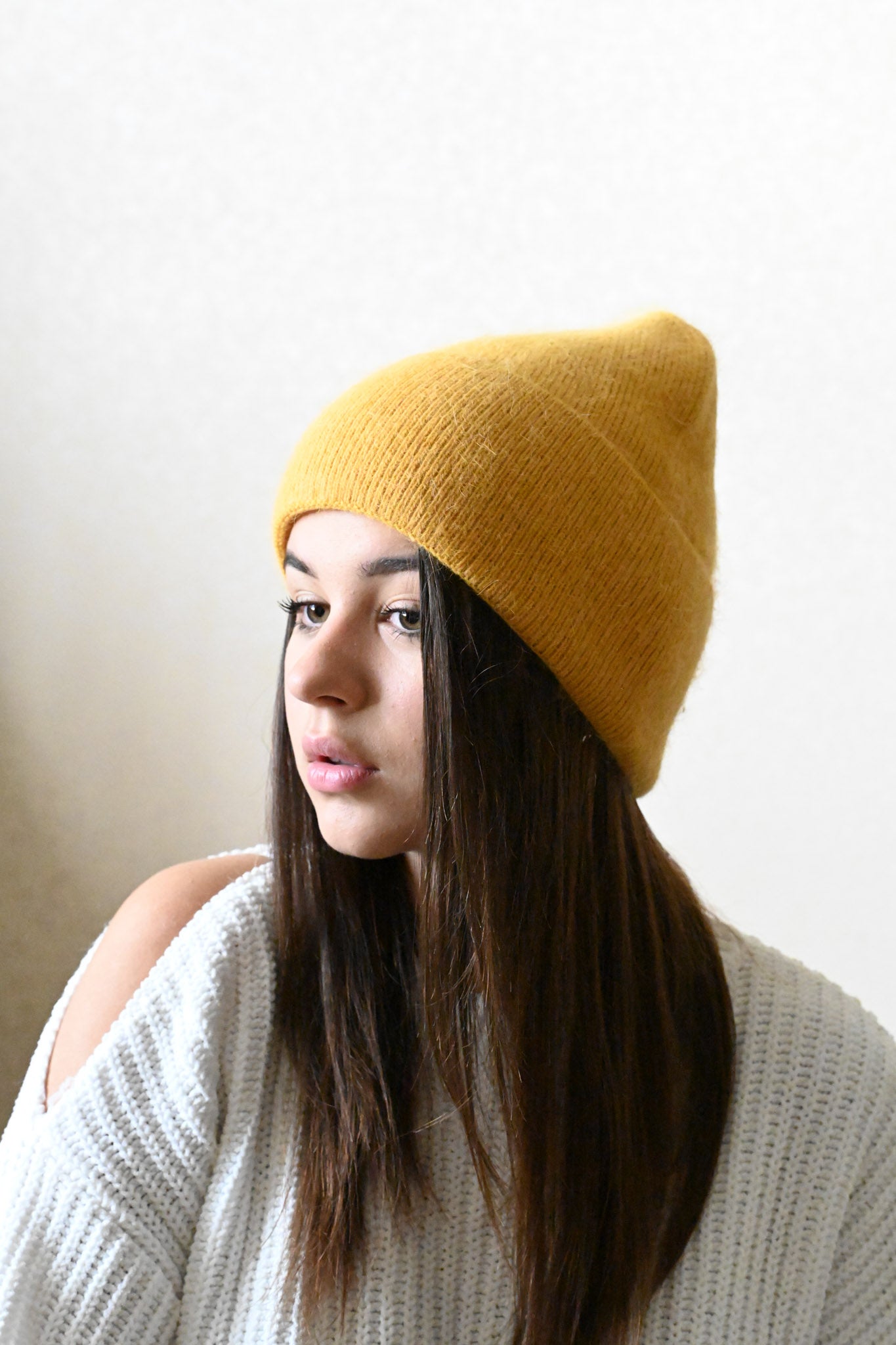 Warm, soft and fluffy hat made of merino wool and angora wool, mustard