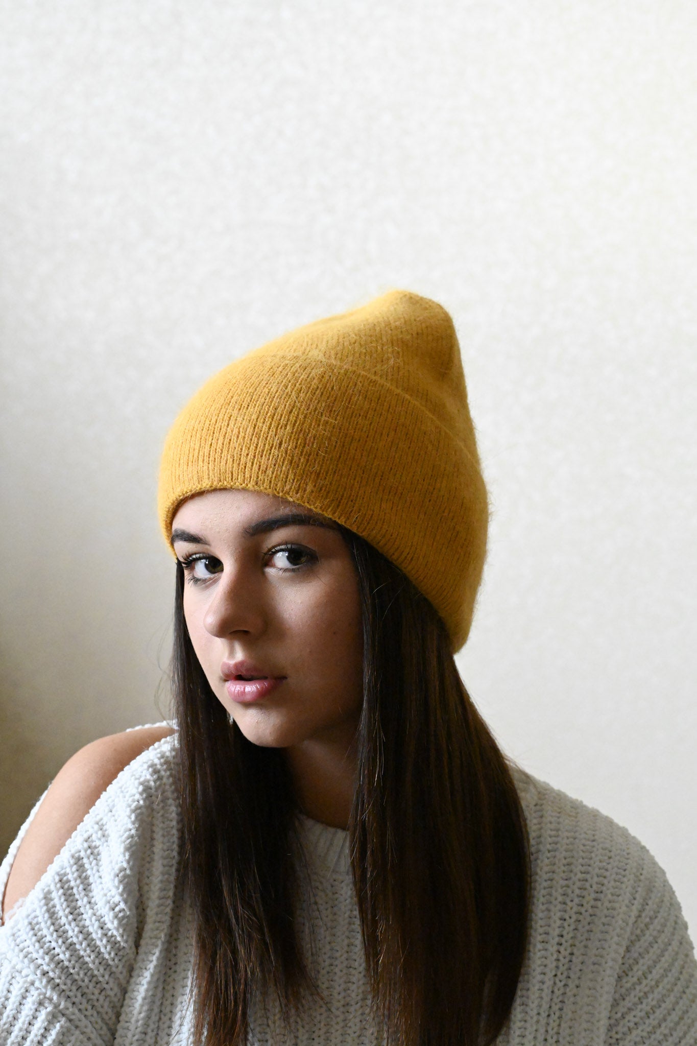 Warm, soft and fluffy hat made of merino wool and angora wool, mustard