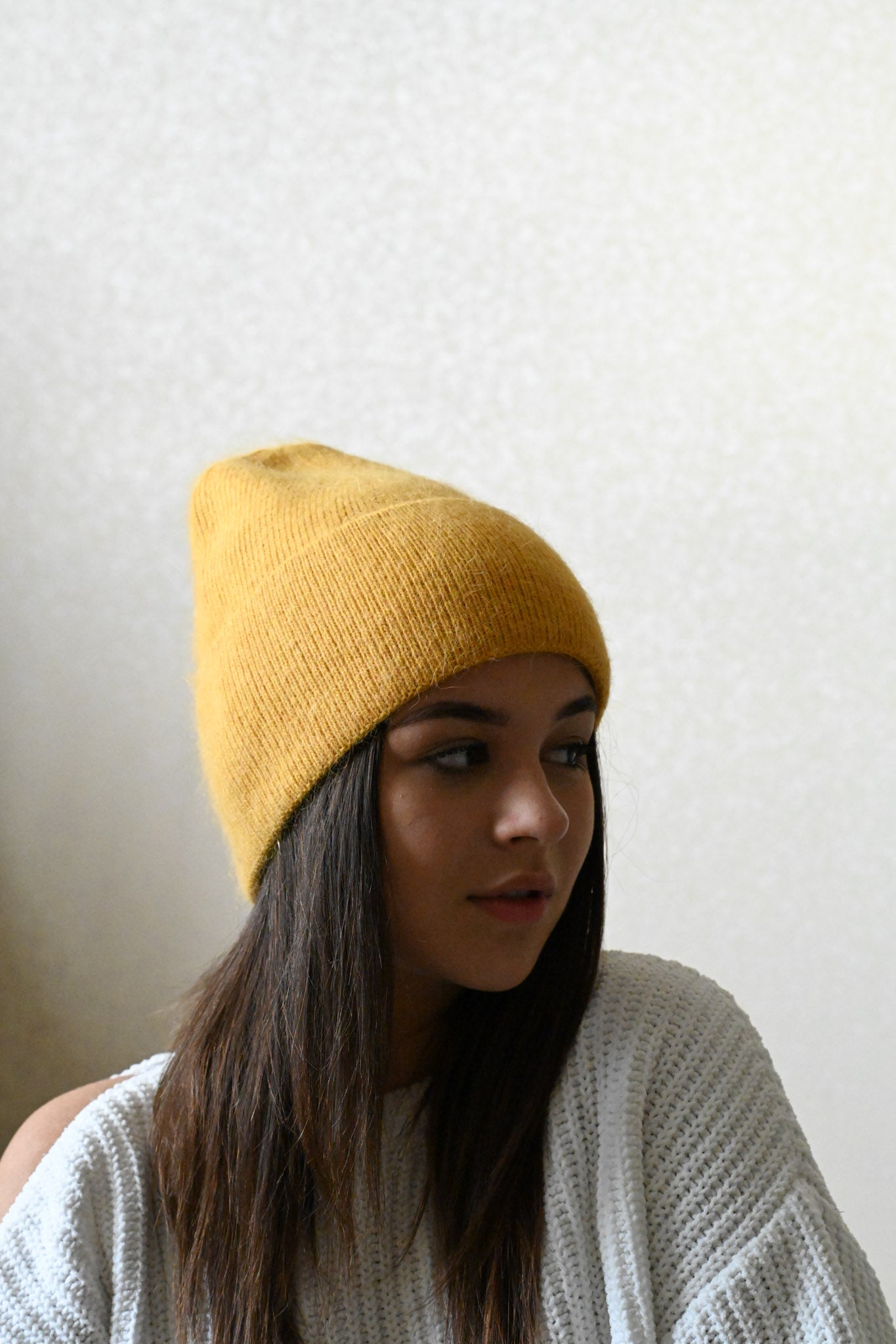 Warm, soft and fluffy hat made of merino wool and angora wool, mustard