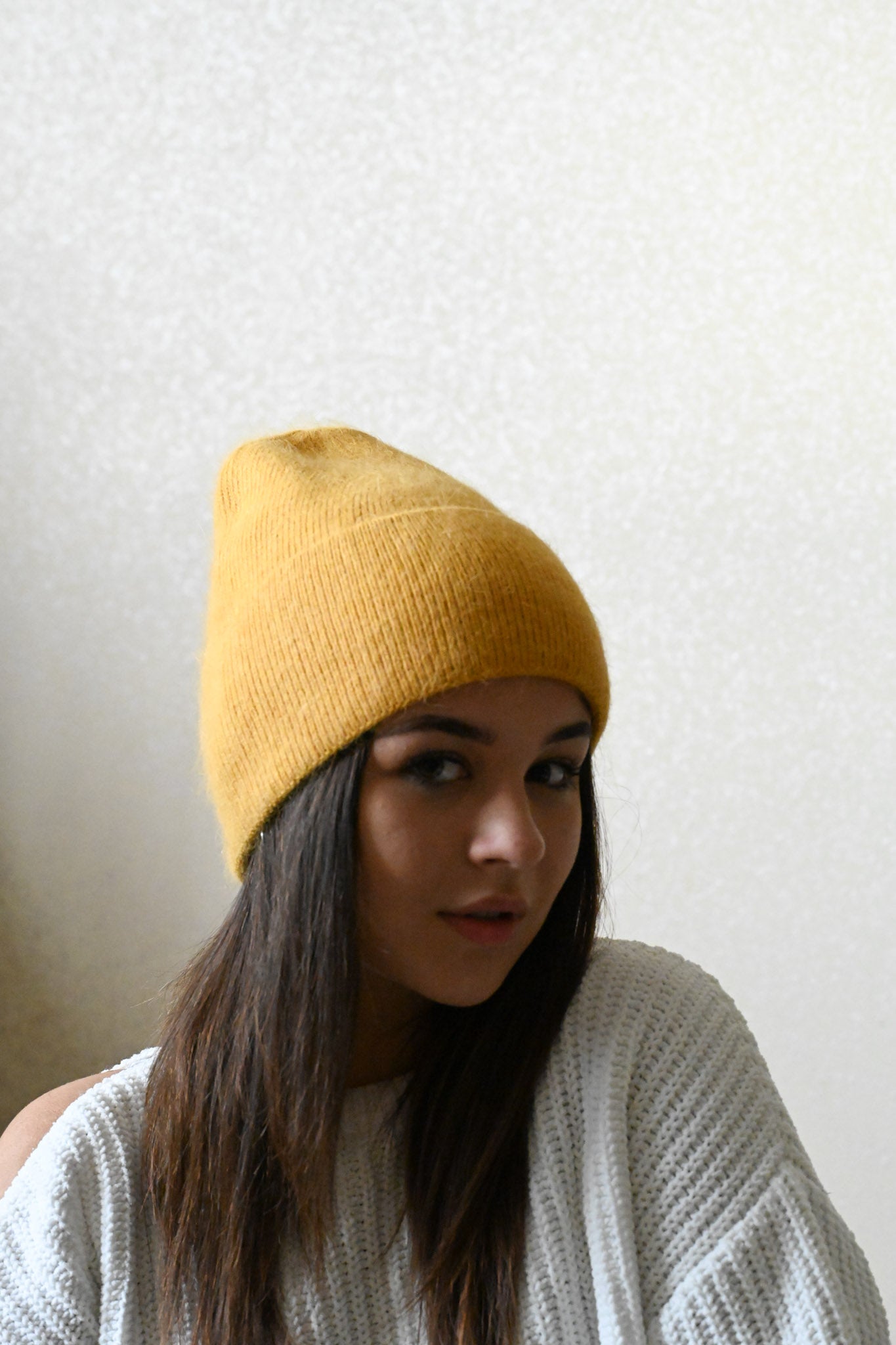 Warm, soft and fluffy hat made of merino wool and angora wool, mustard