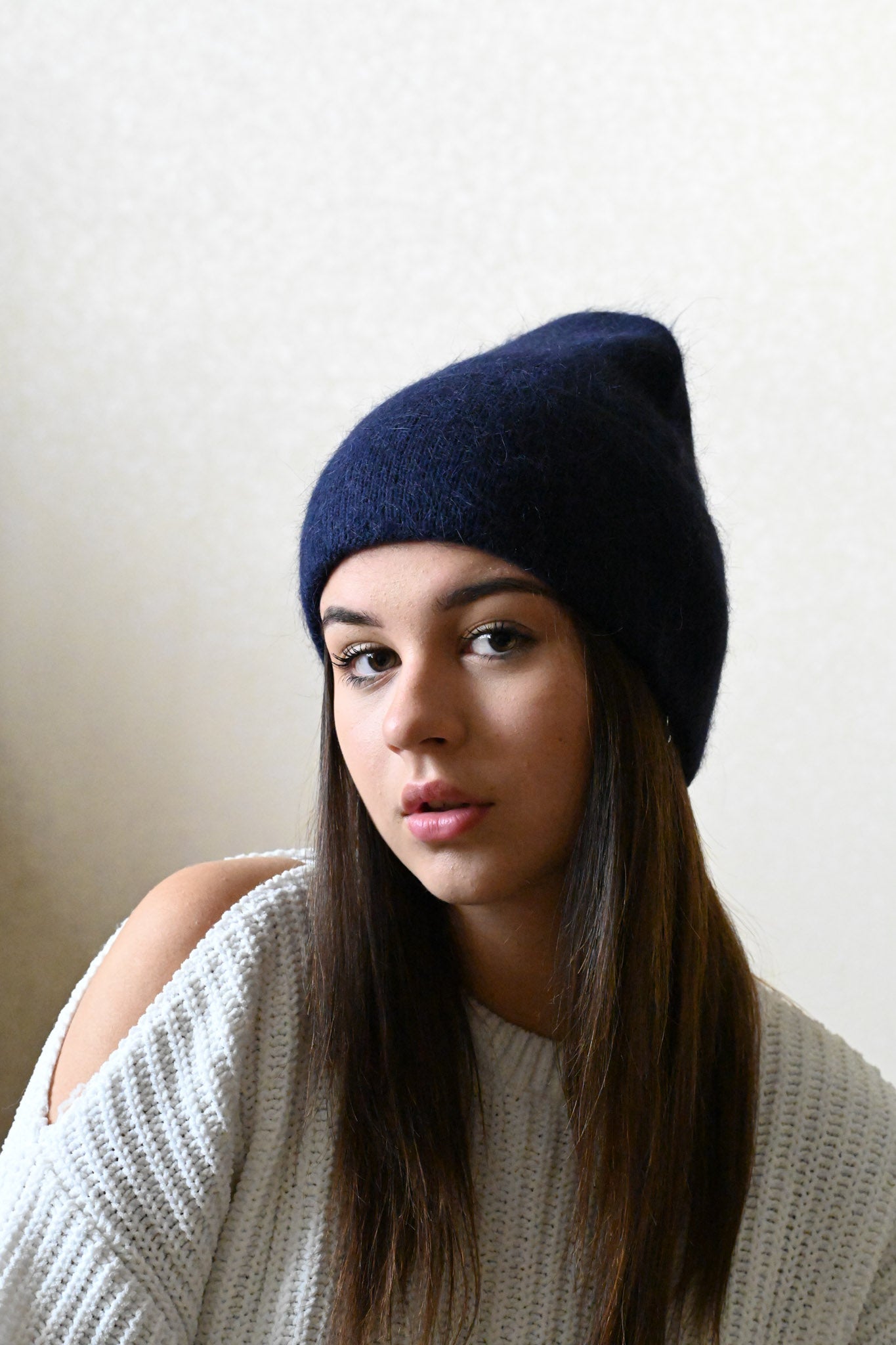 Warm, soft and fluffy hat made of merino wool and angora wool, navy blue