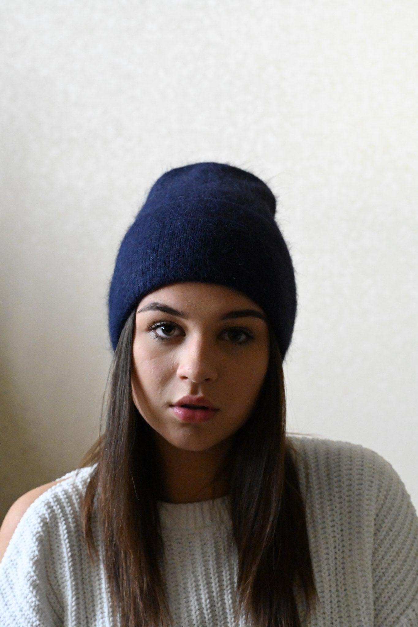 Warm, soft and fluffy hat made of merino wool and angora wool, navy blue