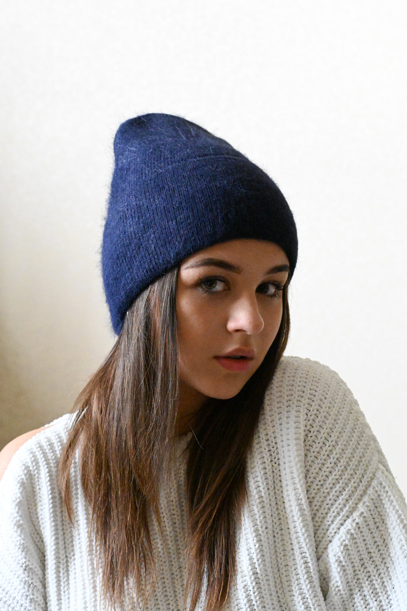 Warm, soft and fluffy hat made of merino wool and angora wool, navy blue
