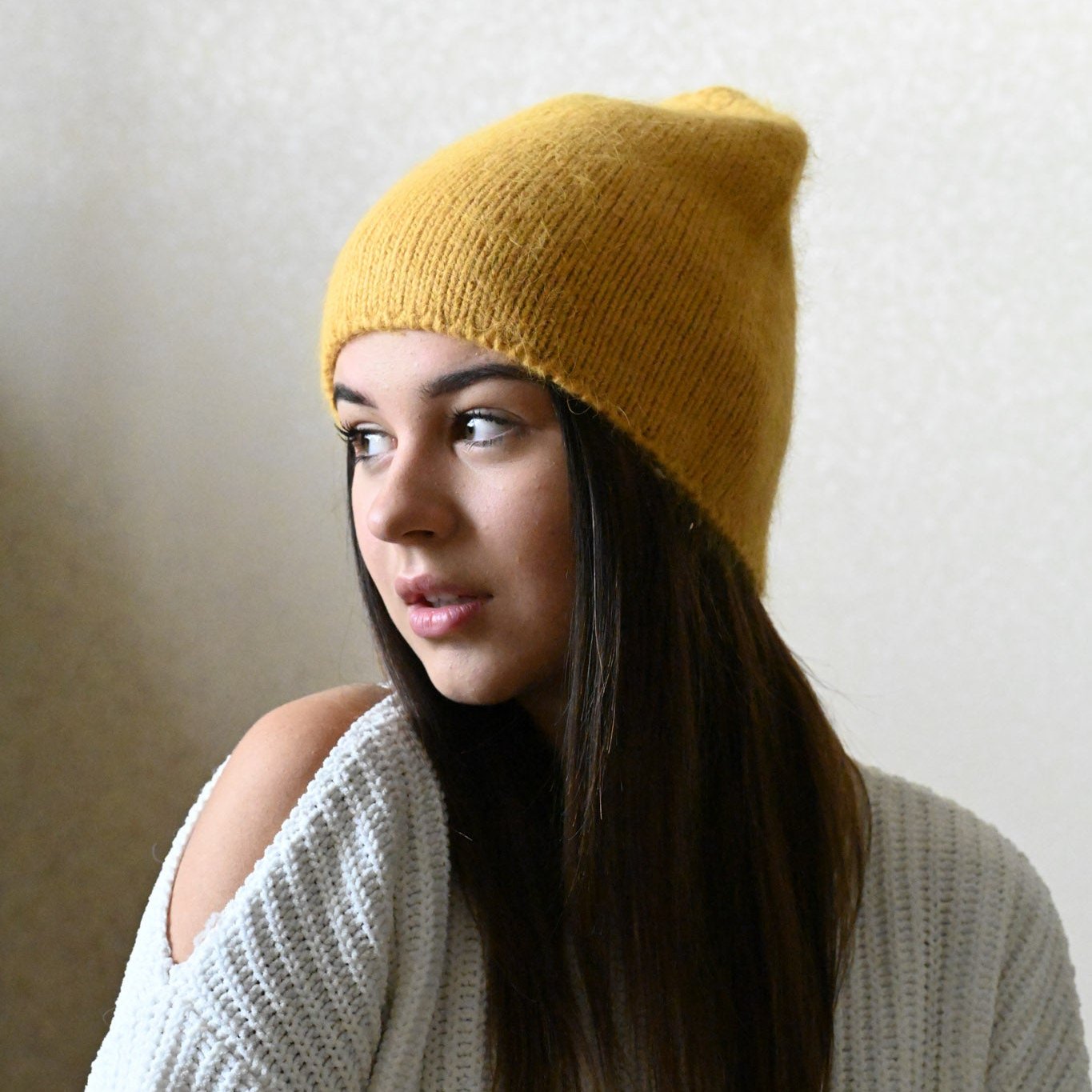 Thin soft beanie made of Angora wool, mustard
