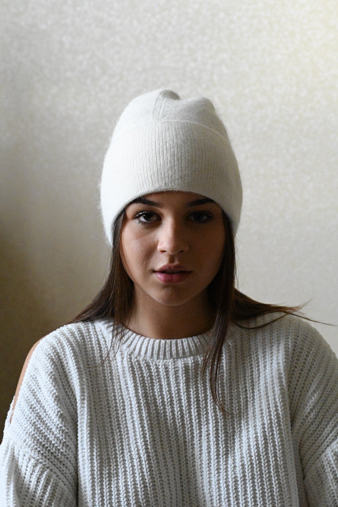 Warm, soft and fluffy hat made of merino wool and angora wool, white