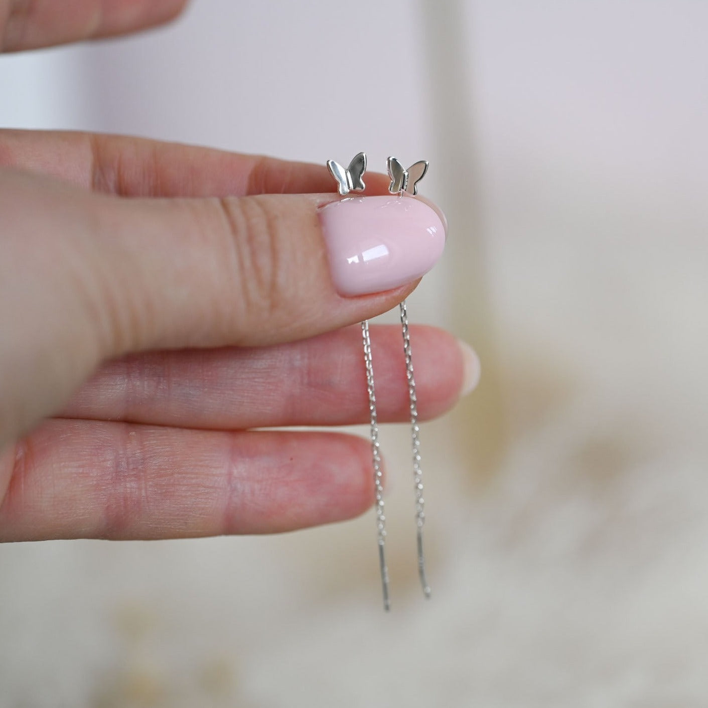 Delicate chain earrings with butterfly
