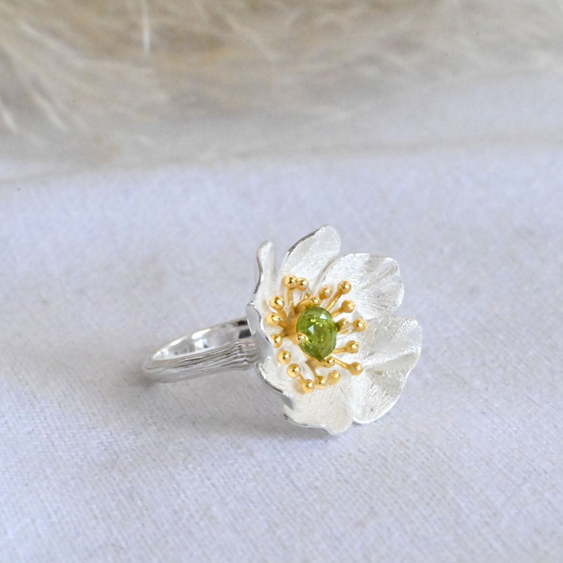 Handmade ring "Blooming Anemone" with peridot