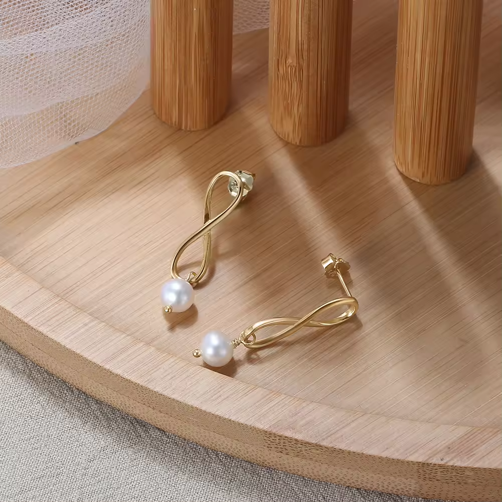 Earrings Elegant simplicity with infinity sign and pearl