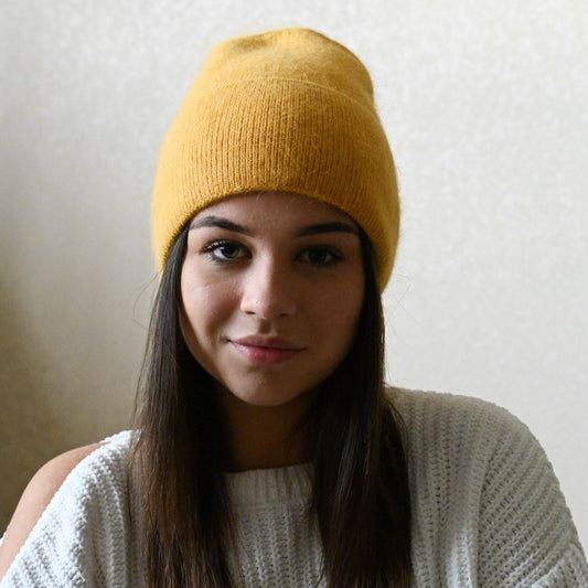 Warm, soft and fluffy hat made of merino wool and angora wool, mustard