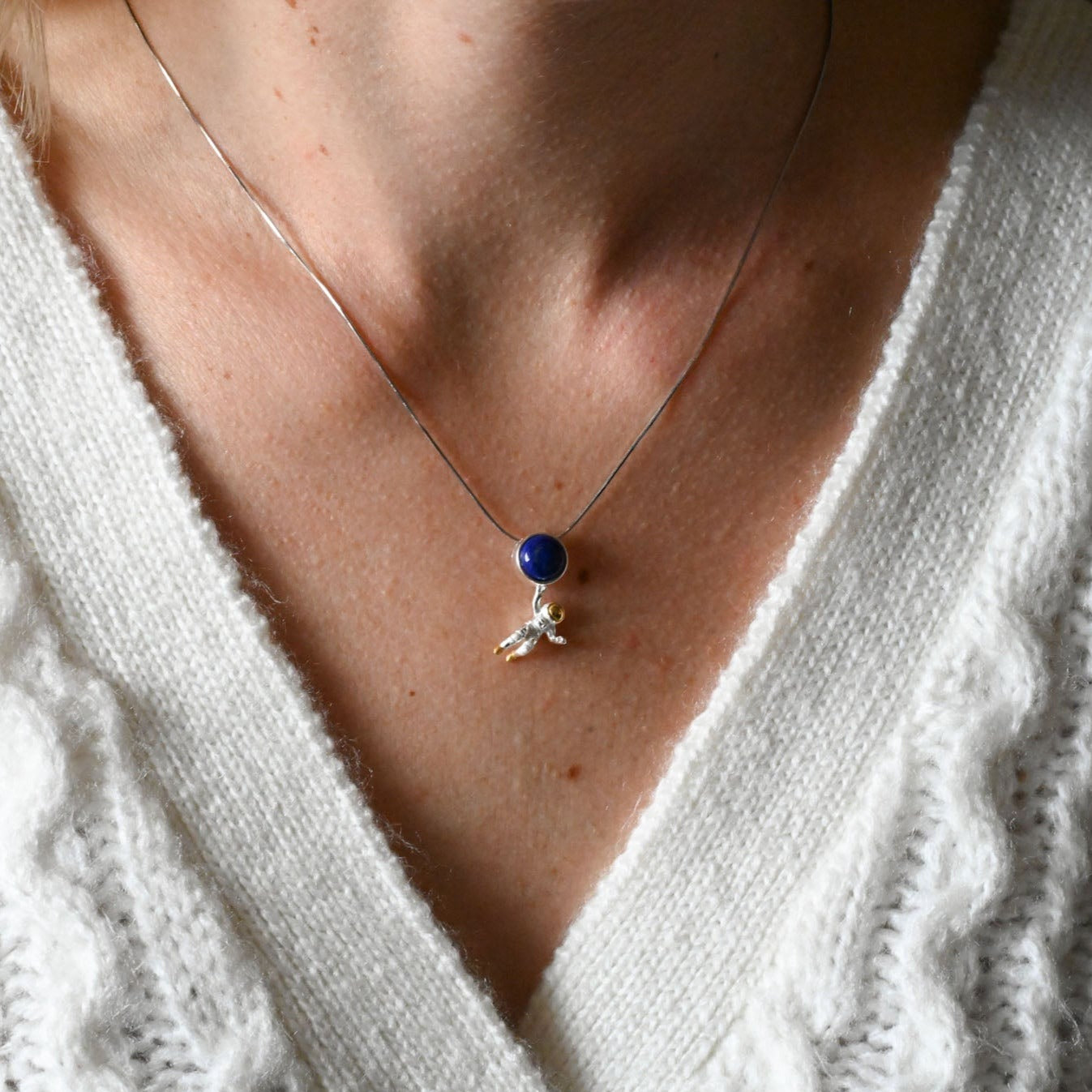 Necklace with lapis astronaut pendant