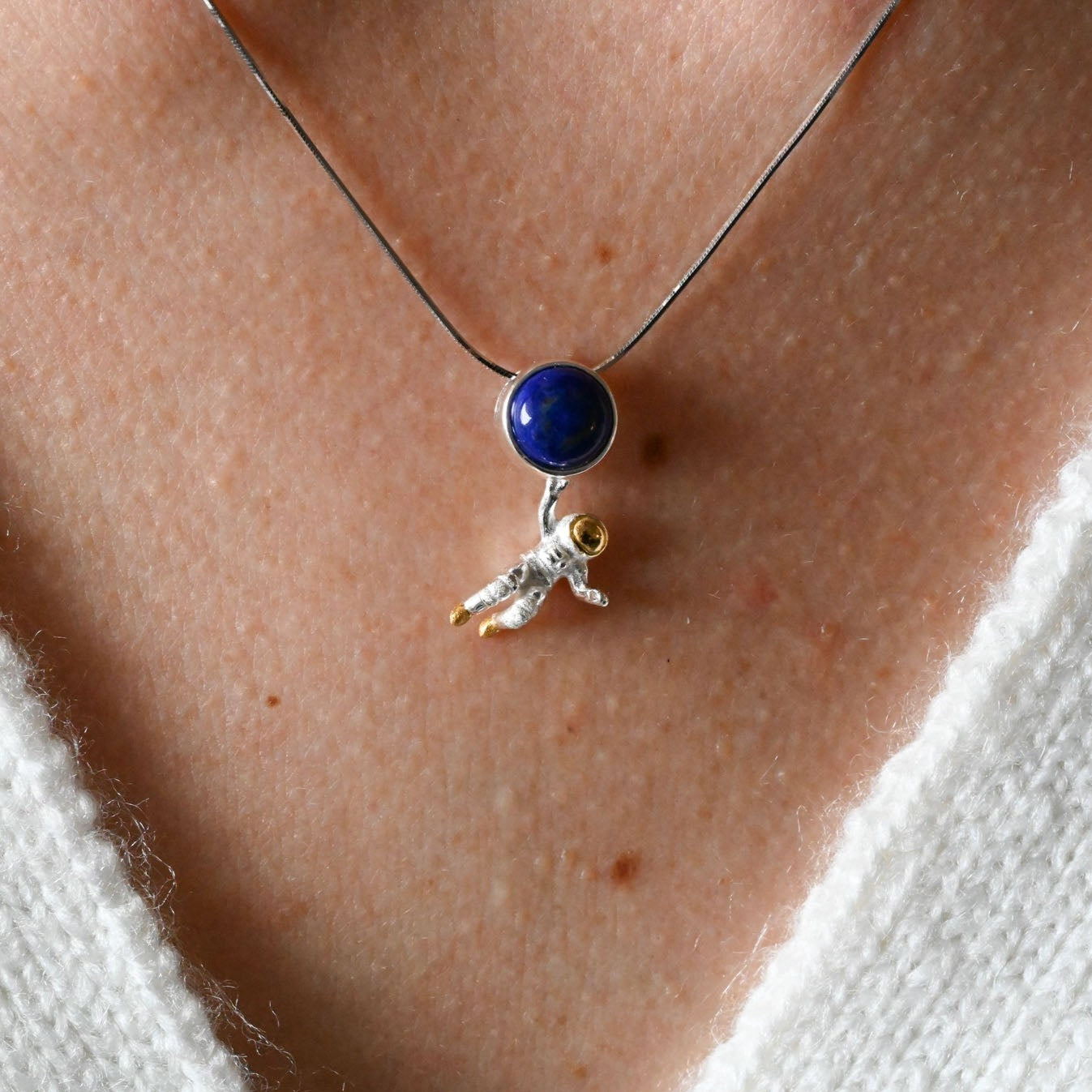 Necklace with lapis astronaut pendant