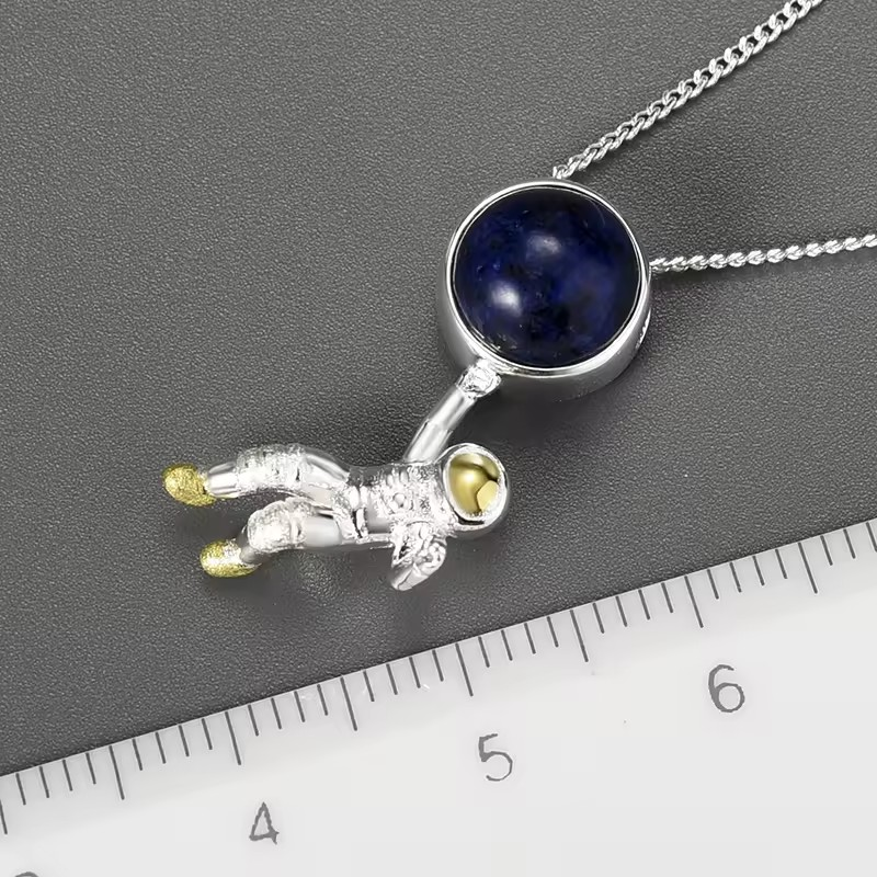 Necklace with lapis astronaut pendant