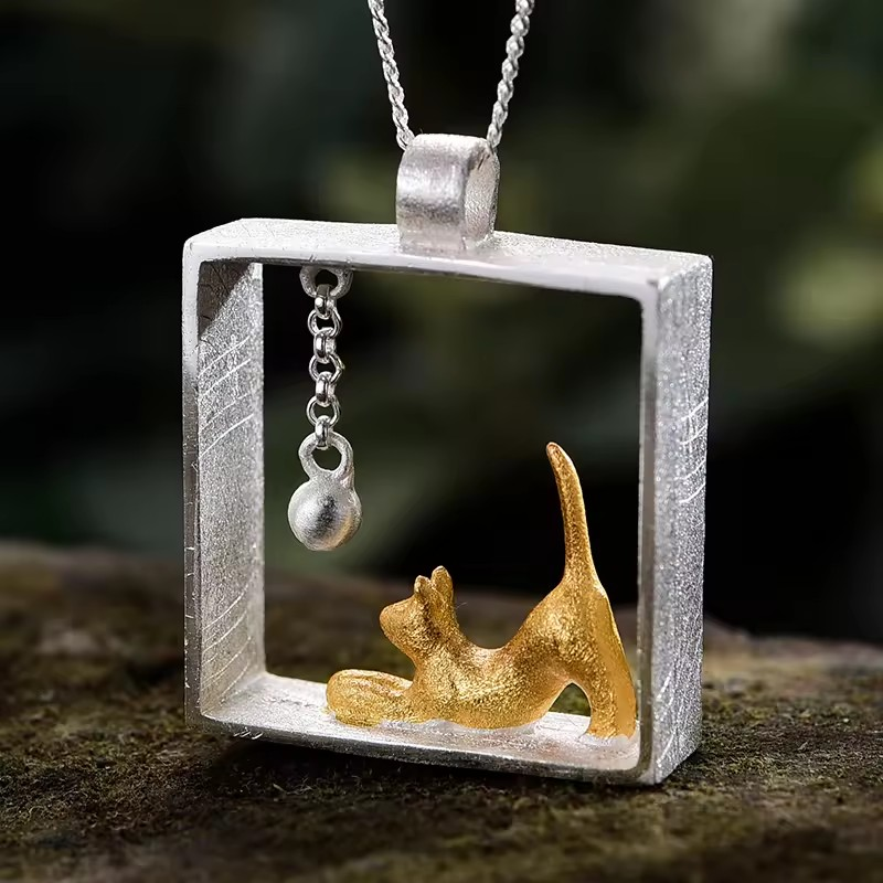 Necklace with pendant "Cat playing with ball", 925 silver, 18K gold